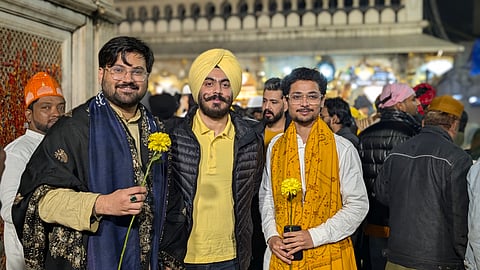  Devotees arrived in impressive numbers, undeterred, their yellow attire, turbans, scarves, and offerings glowing even brighter against the gray skies.
