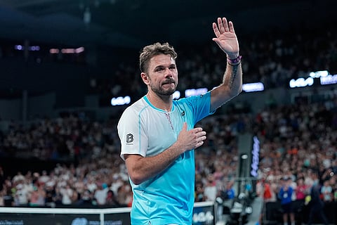 Stan Wawrinka of Switzerland waves as he leaves the court following his third round loss to Taylor Fritz of the U.S. at the Australian Open tennis championship in Melbourne, Australia.
