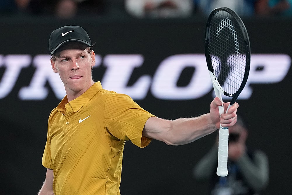 | Photo: AP/Dita Alangkara : Jannik Sinner of Italy reacts after defeating Eliot Spizzirri of the U.S. in their third round match at the Australian Open tennis championship in Melbourne, Australia.