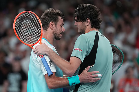 Taylor Fritz, right, of the U.S. is congratulated by Stan Wawrinka, left, of Switzerland following their third round match at the Australian Open tennis championship in Melbourne, Australia.