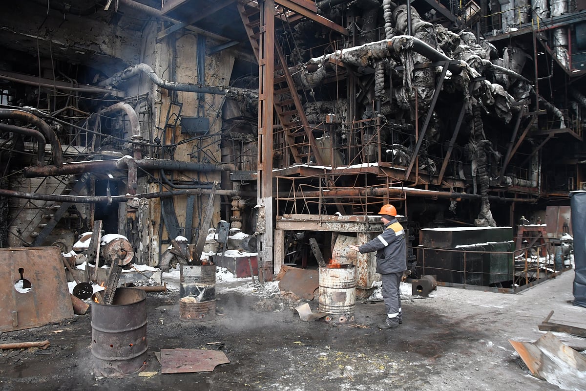 (AP Photo/Mykola Tys) : Workers repair the destroyed DTEK company's power plant after a recent Russian missile attack on the country's energy system in an undisclosed location in Ukraine Friday, Jan. 23, 2026. 