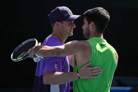 Carlos Alcaraz, right, of Spain is congratulated by Tommy Paul, left, of the U.S. during their fourth round match at the Australian Open tennis championship in Melbourne, Australia.