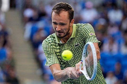 Daniil Medvedev of Russia plays a backhand return to Learner Tien of the U.S. during their fourth round match at the Australian Open tennis championship in Melbourne, Australia.
