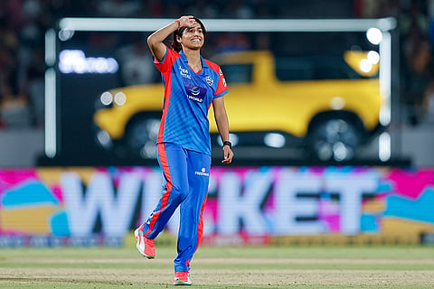 Delhi Capitals' Nandani Sharma celebrates after taking the wicket of Royal Challengers Bengaluru's Sayali Satghare during the Women's Premier League (WPL) 2026 T20 cricket match between Royal Challengers Bengaluru and Delhi Capitals, at BCA Stadium, in Vadodara, Gujarat.