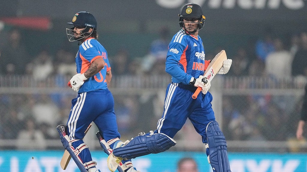 Photo: AP : Ishan Kishan, left, and Abhishek Sharma run between the wickets during the third T20 match between India and New Zealand in Guwahati.