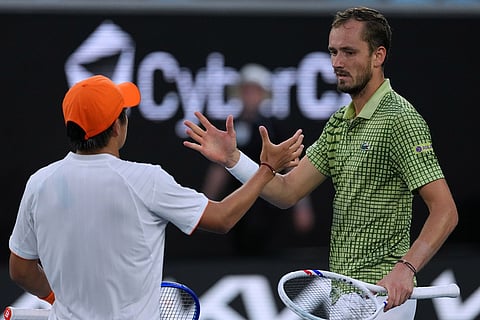 Learner Tien, left, of the U.S. is congratulated by Daniil Medvedev, right, of Russia following their fourth round match at the Australian Open tennis championship in Melbourne, Australia.
