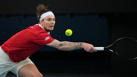 Alexander Bublik of Kazakhstan plays a backhand return to Alex de Minaur of Australia during their fourth round match at the Australian Open tennis championship in Melbourne, Australia.