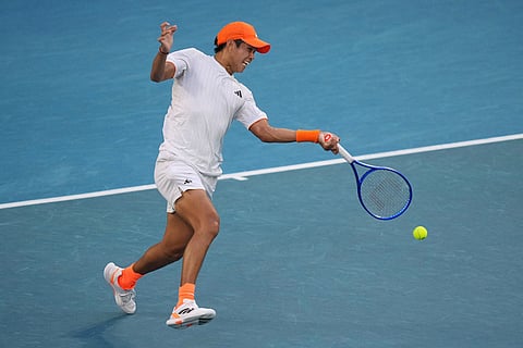 Learner Tien of the U.S. plays a forehand return to Daniil Medvedev of Russia during their fourth round match at the Australian Open tennis championship in Melbourne, Australia.