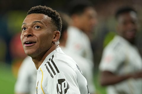 Real Madrid's Kylian Mbappe celebrates after scoring the opening goal during a Spanish La Liga soccer match between Villarreal and Real Madrid in Villarreal, Spain.