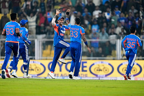India's captain Suryakumar Yadav, third left, and Hardik Pandya, second right, celebrates the dismissal of New Zealand's Rachin Ravindra during the third T20 cricket match between India and New Zealand in Guwahati, India.