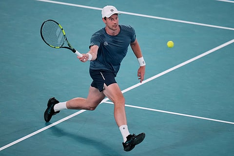 Botic van de Zandschulp of the Netherlands plays a backhand return to Novak Djokovic of Serbia during their third round match at the Australian Open tennis championship in Melbourne, Australia.
