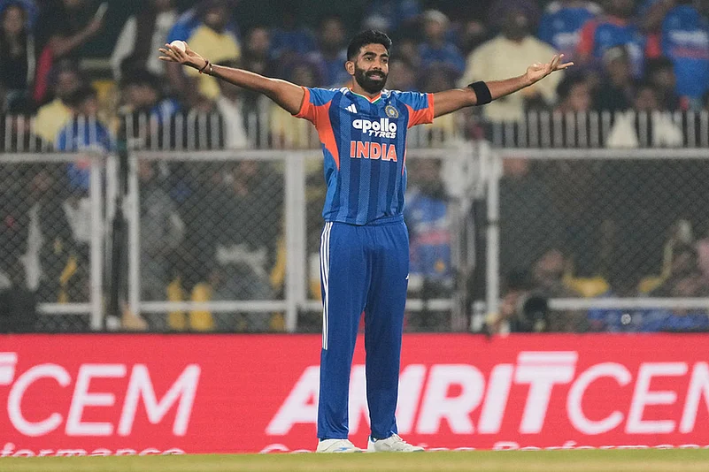 Indias Jasprit Bumrah celebrates the dismissal of New Zealands captain Mitchell Santner