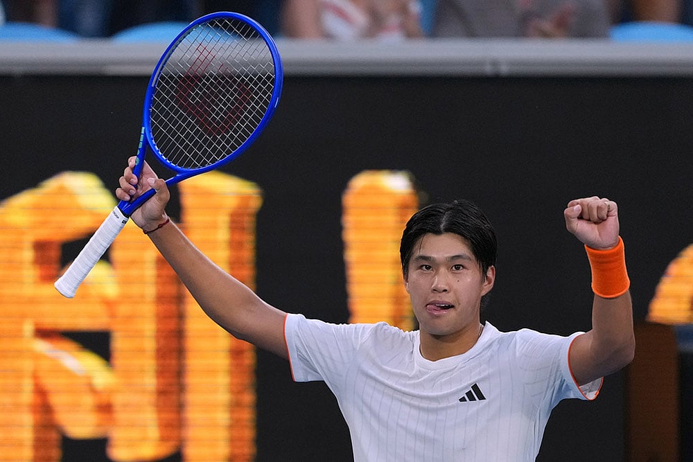| Photo: AP/Asanka Brendon Ratnayake : Learner Tien of the U.S. celebrates after defeating Daniil Medvedev of Russia in their fourth round match at the Australian Open tennis championship in Melbourne, Australia.