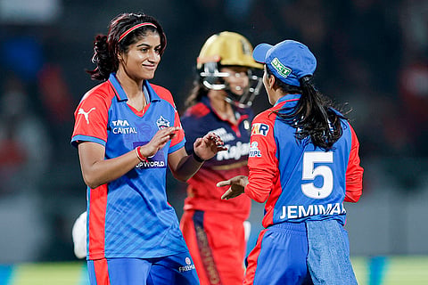 Delhi Capitals' Nandani Sharma celebrates with captain Jemimah Rodrigues after taking the wicket of Royal Challengers Bengaluru's Shreyanka Patil during the Women's Premier League (WPL) 2026 T20 cricket match between Royal Challengers Bengaluru and Delhi Capitals, at BCA Stadium, in Vadodara, Gujarat.