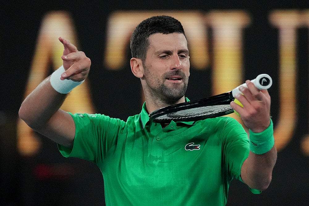 | Photo: AP/Dita Alangkara : Novak Djokovic of Serbia reacts after defeating Botic van de Zandschulp of the Netherlands in their third round match at the Australian Open tennis championship in Melbourne, Australia.