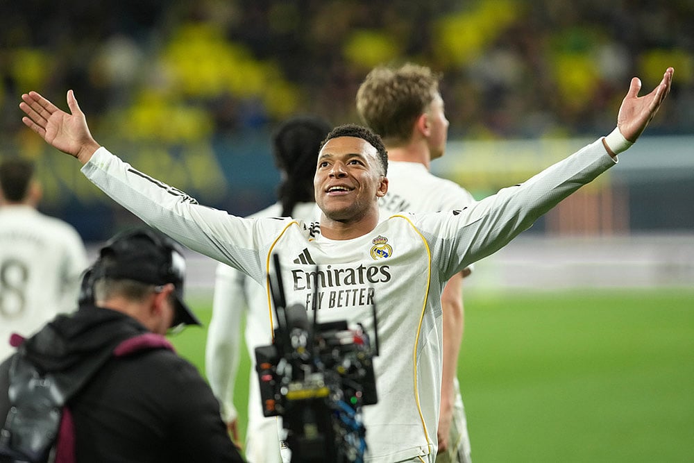 | Photo: AP/Alberto Saiz : Real Madrid's Kylian Mbappe celebrates after the Spanish La Liga soccer match between Villarreal and Real Madrid in Villarreal, Spain.
