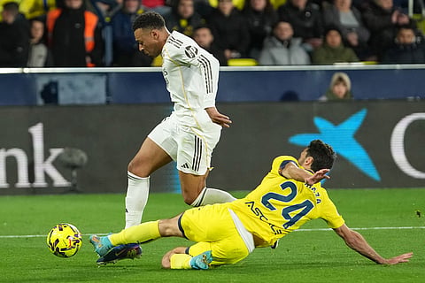 Villarreal's Alfonso Pedraza fouls Real Madrid's Kylian Mbappe to give away penalty during a Spanish La Liga soccer match between Villarreal and Real Madrid in Villarreal, Spain.