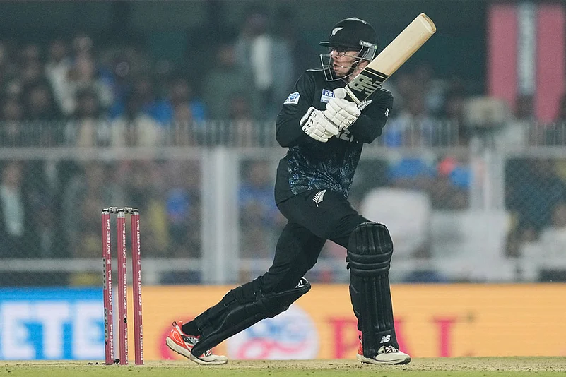 New Zealands captain Mitchell Santner plays a shot