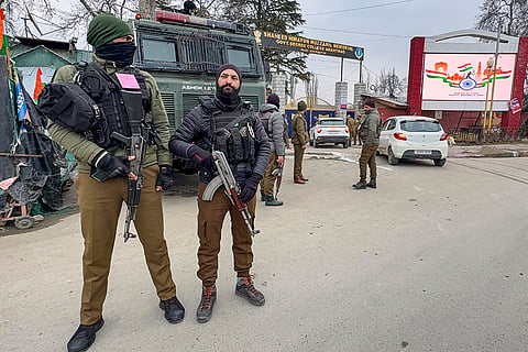 Security personnel keep vigil amid high alert during the 77th Republic Day celebrations, near Shaheed Himayun Muzzamil Memorial Government Degree College, in Anantnag district, Jammu and Kashmir.