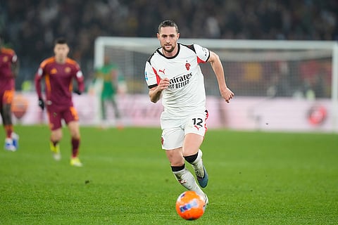 AC Milan's Adrien Rabiot controls the ball during the Serie A soccer match between Roma and AC Milan in Rome.