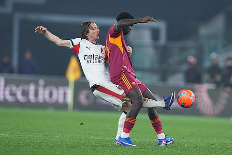 AC Milan's Luka Modric fights for the ball with Roma's Robinio Vaz during the Serie A EniLive soccer match between Roma and Milan in Rome, Italy.