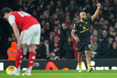 Manchester United's Bryan Mbeumo celebrates after scoring his side's first goal during the English Premier League soccer match between Arsenal and Manchester United in London.