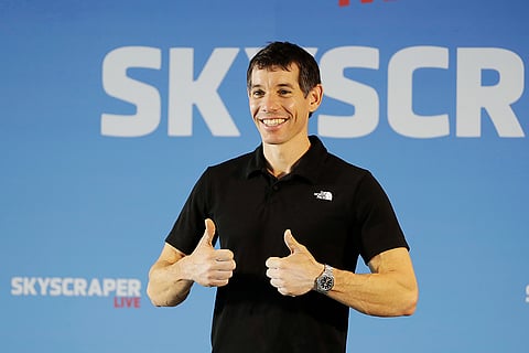 Rock climber Alex Honnold, of the U.S., poses for a photo during a news conference after he completed a free solo climb of the Taipei 101 skyscraper in Taipei, Taiwan.