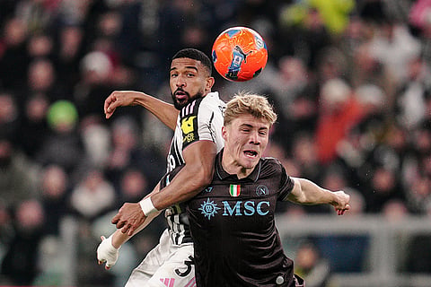 Juventus' Bremer, left, fights for the ball with Napoli's Rasmus Hojlund during the Italian Serie A soccer match between Juventus and Napoli in Turin, Italy.