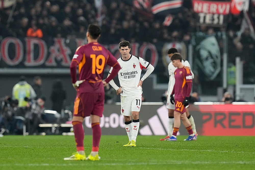 | Photo: AP/Gregorio Borgia : AC Milan's Christian Pulisic, centre, and Roma's Zeki Celik react after the Serie A soccer match between Roma and AC Milan in Rome.