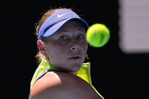 Amanda Anisimova of the U.S. plays a backhand return to Wang Xinyu of China during their fourth round match at the Australian Open tennis championship in Melbourne, Australia.