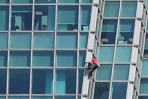 Rock climber Alex Honnold, of the U.S., performs a free solo climb of the Taipei 101 skyscraper in Taipei, Taiwan.