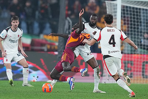 AC Milan's Fikayo Tomori tackles Roma's Robinio Vaz during the Serie A EniLive soccer match between Roma and Milan in Rome, Italy.