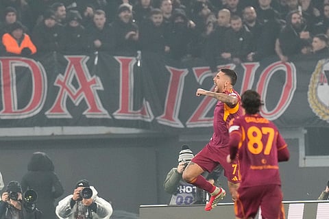 Roma's Lorenzo Pellegrini, celebrates after scoring his side's first goal during the Serie A soccer match between Roma and AC Milan in Rome.
