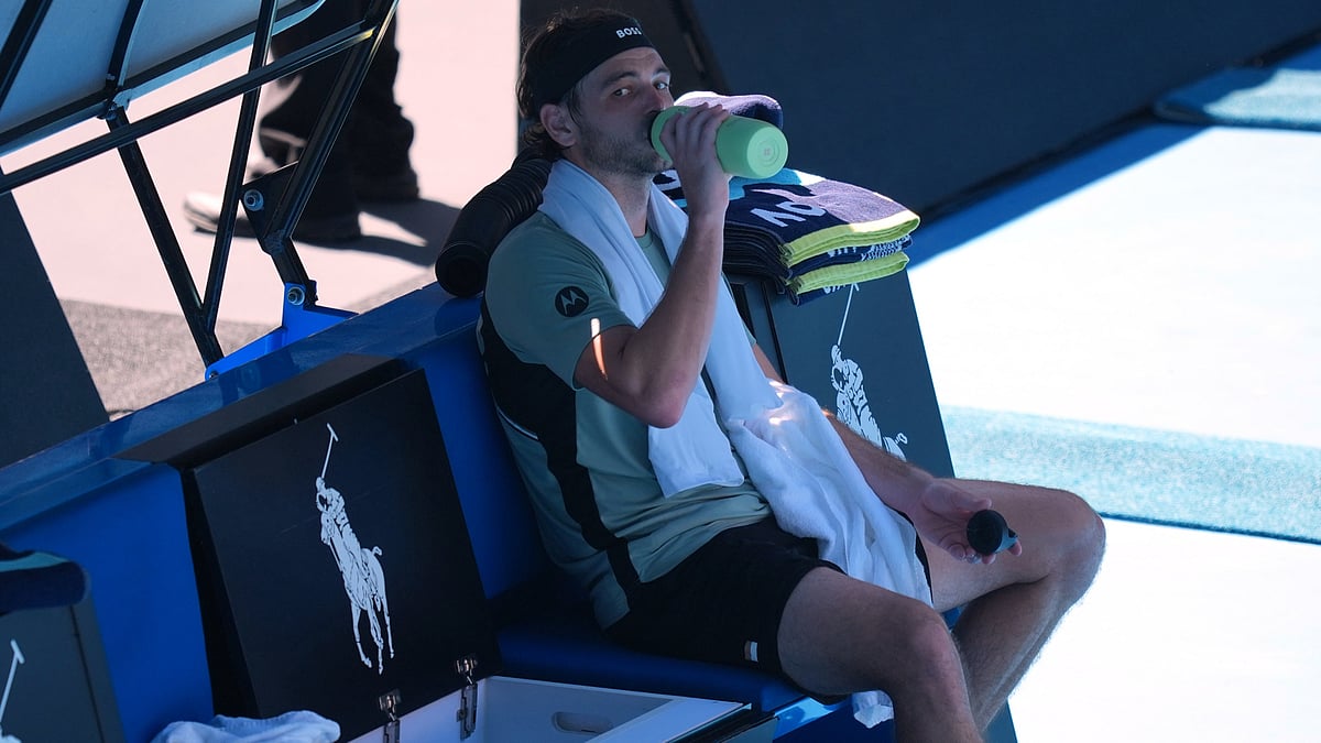 | Photo: AP/Mark Baker : Taylor Fritz of the U.S. takes a drink as he plays against Lorenzo Musetti of Italy during their fourth round match at the Australian Open tennis championship in Melbourne, Australia, Monday, Jan. 26, 2026. 