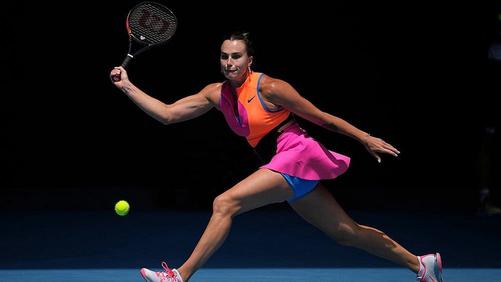 Photo: AP/Dita Alangkara : Aryna Sabalenka of Belarus plays a forehand return to Victoria Mboko of Canada during their fourth round match at the Australian Open tennis championship in Melbourne, Australia.