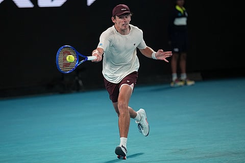 Alex de Minaur of Australia plays a forehand return to Carlos Alcaraz of Spain during their quarterfinal match at the Australian Open tennis championship in Melbourne, Australia.