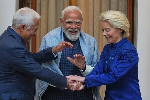 Indian Prime Minister Narendra Modi, center, welcomes European Council President Antonio Costa, left and European Commission President Ursula von der Leyen before their meeting in New Delhi.