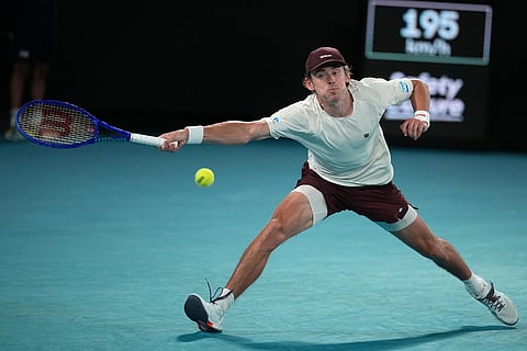 Alex de Minaur of Australia plays a forehand return to Carlos Alcaraz of Spain during their quarterfinal match at the Australian Open tennis championship in Melbourne, Australia.