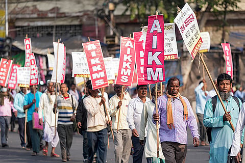 Members of the All India Kisan Khet Mazdoor Sangathan take part in a rally demanding assured remunerative prices for farmers' crops, repeal of the newly introduced labour codes and higher wages for MGNREGA workers, in Kolkata.