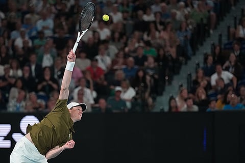 Jannik Sinner of Italy serves to Ben Shelton of the U.S. during their quarterfinal match at the Australian Open tennis championship in Melbourne, Australia.