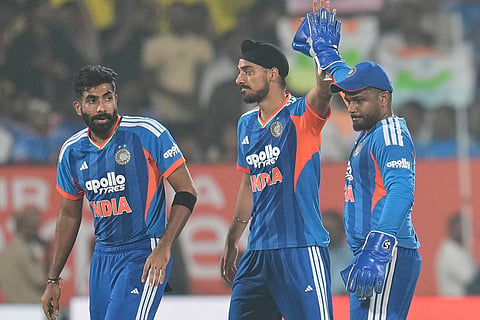 India's Arshdeep Singh, center, celebrates with teammates after the dismissal of New Zealand's Tim Seifert during the fourth T20 cricket match between India and New Zealand in Visakhapatnam.