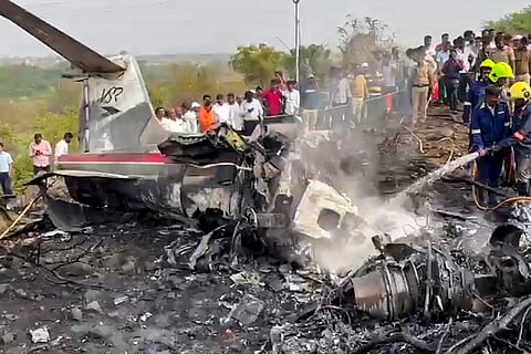 Firefighters at the site after an aircraft carrying Maharashtra Deputy Chief Minister Ajit Pawar crashed during landing, at Baramati in Pune district, Maharashtra.