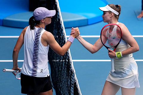Elena Rybakina, right, of Kazakhstan is congratulated by Iga Swiatek, left, of Poland following their quarterfinal match at the Australian Open tennis championship in Melbourne, Australia.