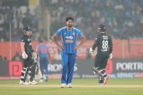 India's Harshit Rana reacts after a boundary by New Zealand's Tim Seifert, left, during the fourth T20 cricket match between India and New Zealand in Visakhapatnam.