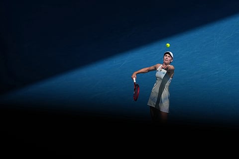 Elena Rybakina of Kazakhstan serves to Iga Swiatek of Poland during their quarterfinal match at the Australian Open tennis championship in Melbourne, Australia.