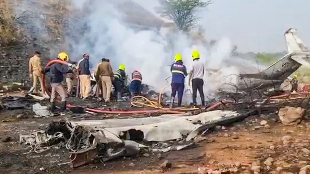 Photo: PTI : Rescue work underway after an aircraft carrying Maharashtra Deputy Chief Minister Ajit Pawar crashed during landing, at Baramati in Pune district, Maharashtra.