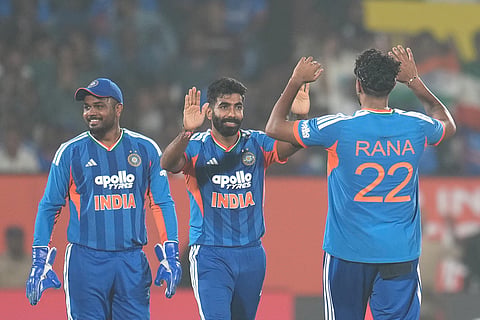 India's Jasprit Bumrah, center, celebrates the dismissal of New Zealand's Rachin Ravindra with his teammates during the fourth T20 cricket match between India and New Zealand in Visakhapatnam.