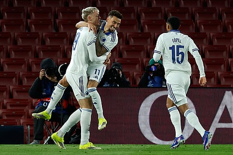 Copenhagen's Vicktor Dabason celebrates with Jordan Larsson the opening goal during the Champions League opening phase soccer match between Barcelona and Copenhagen in Barcelona, Spain.