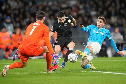 Chelsea's Pedro Neto challenges for the ball with Napoli's Mathias Olivera during a Champions League opening phase soccer match between Napoli and Chelsea, in Naples, Italy.