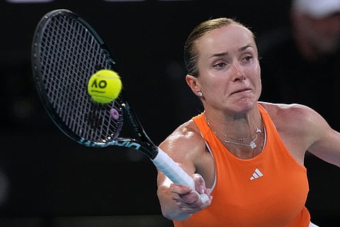 Elina Svitolina of Ukraine plays a forehand return to Aryna Sabalenka of Belarus during their semifinal match at the Australian Open tennis championship in Melbourne, Australia.